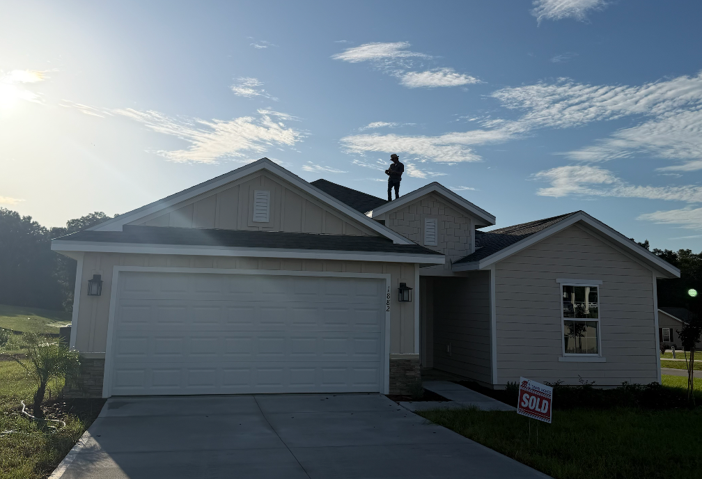 Home inspector on a residential property roof